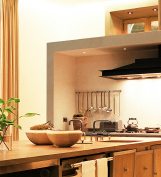 French castle timber kitchen - Kitchen utensils hung close to the cooking line make the kitchen efficient.