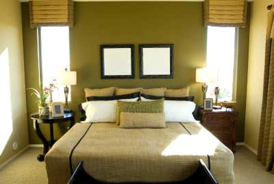 The feature wall color creates a backdrop for the bedroom. 