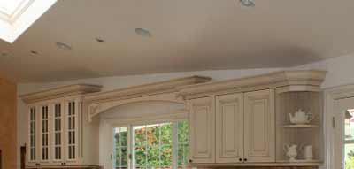 Sloping ceiling kitchen - The planted cornice to the top of the joinery keeps a strong line making the difficult angle from the roof and ceiling lose prominence.