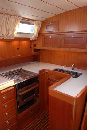 Casement curtains top and bottom are ideal in the ship's kitchen!