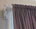 Double curtain tracks (in the form of casement headings, rod and pocket) one for the nets and one for the curtains.
