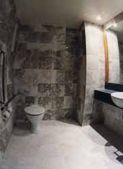 Natural stone flooring - Marble used of floor and walls of a hotel bathroom, very stylish.