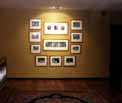 Home Design Tips - Paintings grouped together become a focal point when spotlit.