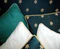 Interior Decoration Tips - Gold cord and ribbon edging these cushions