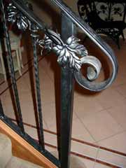 Ferrous Metals - Wrought Iron Balustrade and Handrail with intricate vine and leaf detail.