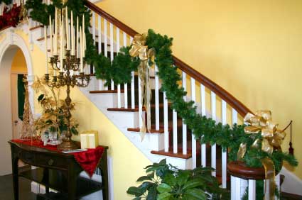 Staircase design - Timber is a very popular material used in stair construction, for the treads and the balusters and handrails shown here, and decorated for Christmas!