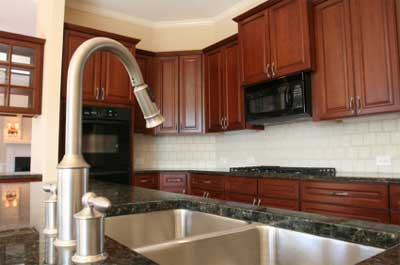 Traditional kitchen with timber cabinetry with tiled splash back and granite counter tops.
