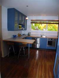 The new kitchen, light and airy, blue cabinetry and artificial timber floor - would you be able to tell the difference?