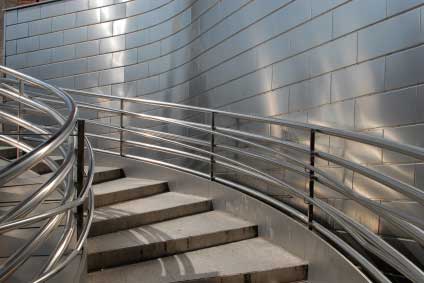 Circular staircase - Stainless steel balustrade and concrete tread and risers in this staircase.